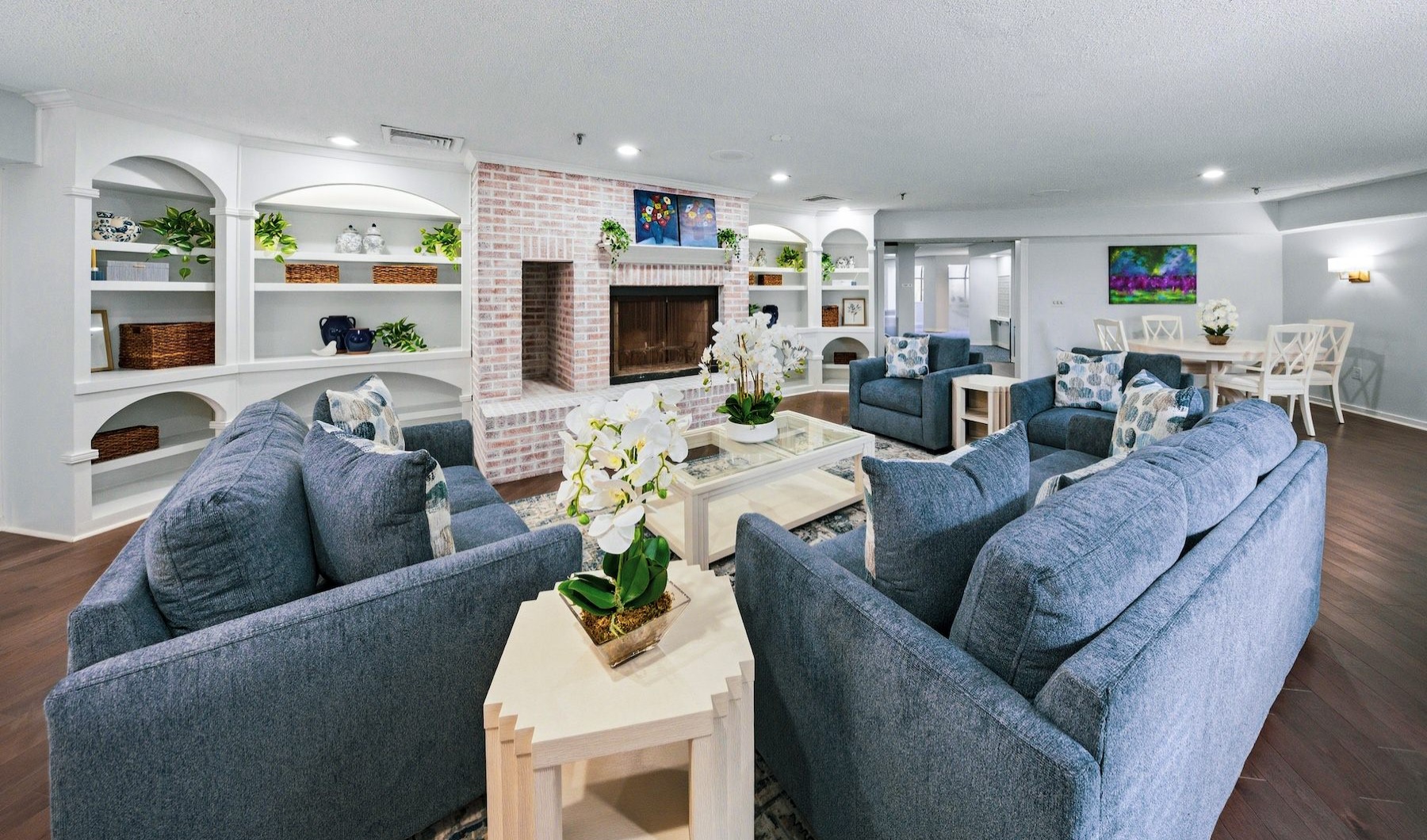 a spacious resident lounge with a fireplace