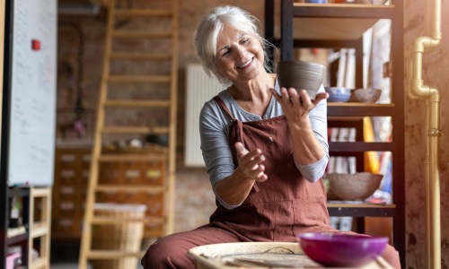 a woman making pottery